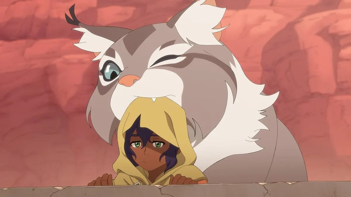 Episode 101 press still: young Pavi in a yellow hood peeking over a ledge beneath Geet, red canyon behind