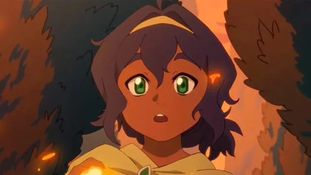 Trailer frame: Pavi lit by embers as fire sparks near her hand