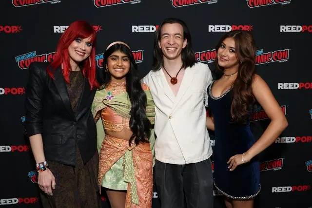 Red-haired moderator posing with three Avatar: Seven Havens voice actors at the NYCC 2026 step-and-repeat. Per the press release, the cast was Saheli Khan, Aishu Devan and Major Curda; positions are not captioned.