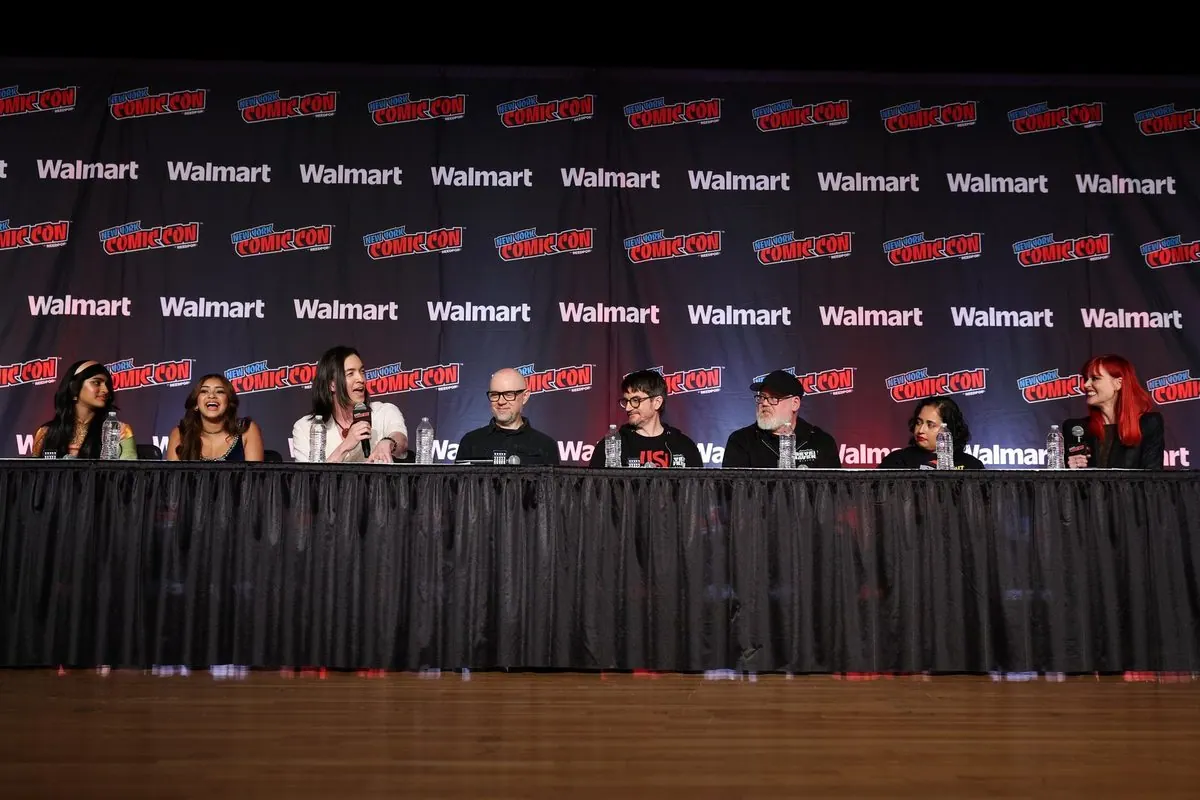 Wide shot of the full NYCC 2026 Avatar panel on stage (where Wave of Chaos was announced): all eight panelists at the table under NYCC and Walmart backdrops