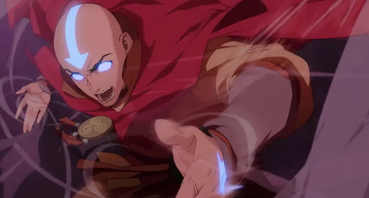 Frame from the official trailer: adult Aang lunging in the Avatar State, eyes and tattoos glowing, red cape whipping