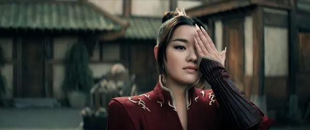 Season 2 Episode 2 still: Elizabeth Yu as Azula covering one eye in a courtyard