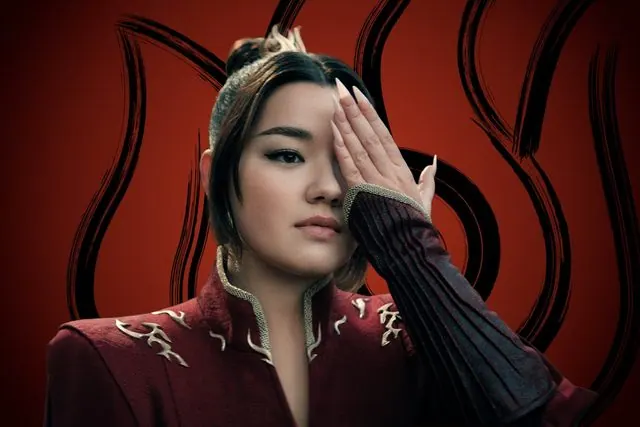 Season 2 character portrait: Elizabeth Yu as Azula covering one eye in front of the Fire Nation emblem