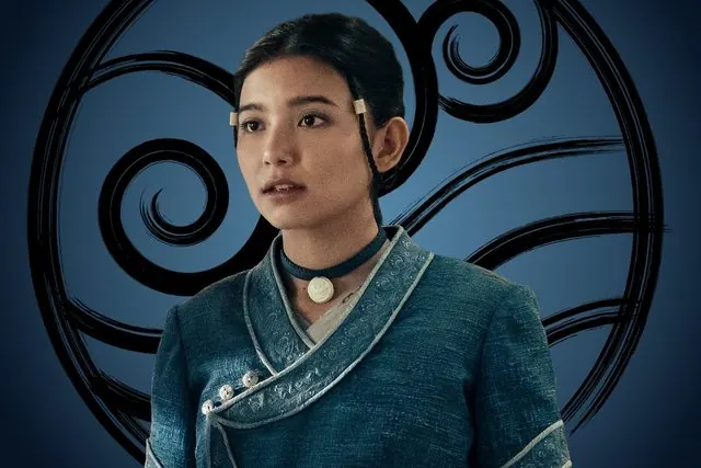 Season 2 character portrait: Kiawentiio as Katara in front of the Water Tribe emblem