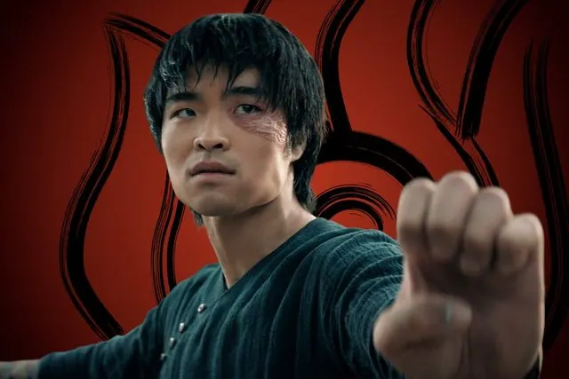 Season 2 character portrait: Dallas Liu as Zuko throwing a punch in front of the Fire Nation emblem