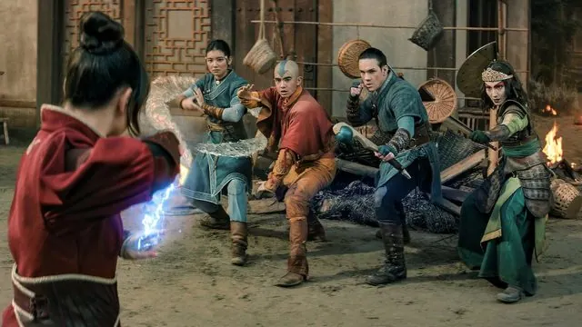 Season 2 still: Azula's blue fire facing Katara, Aang, Sokka and Suki in a wrecked hall