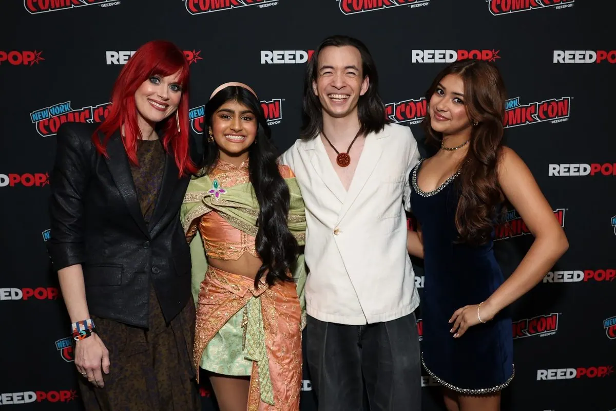 Moderator Janet Varney posing with the Avatar: Seven Havens voice cast at NYCC 2026