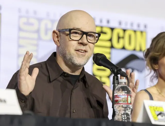 Close-up of Avatar co-creator Michael Dante DiMartino speaking at the SDCC 2026 Hall H panel