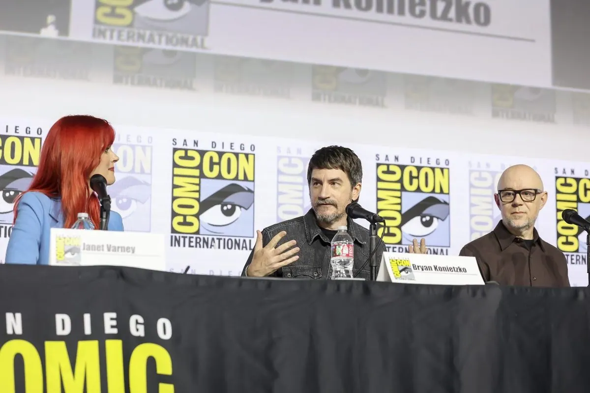 Janet Varney, Bryan Konietzko (speaking, name card visible) and Michael Dante DiMartino at the Hall H table, SDCC 2026